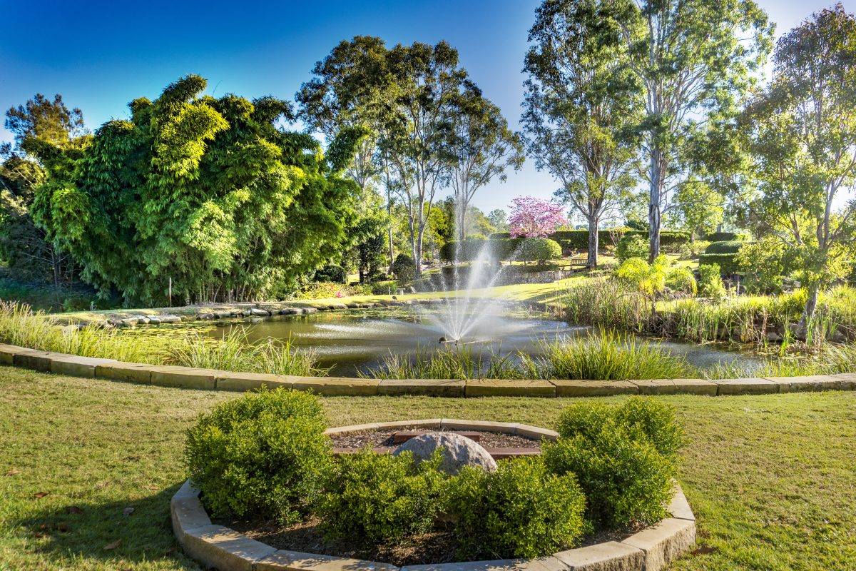 View of the water feature in the centre of Centenary Memorial Gardens which is in the middle of a lake and surrounded by some of CMG's most tranquil burial and cremation gardens.